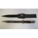 A World War II German SS bayonet, the handle with a hardwood mounted grip,