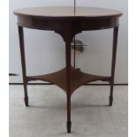 An Edwardian satinwood string inlaid and crossbanded, flame veneered mahogany occasional table,