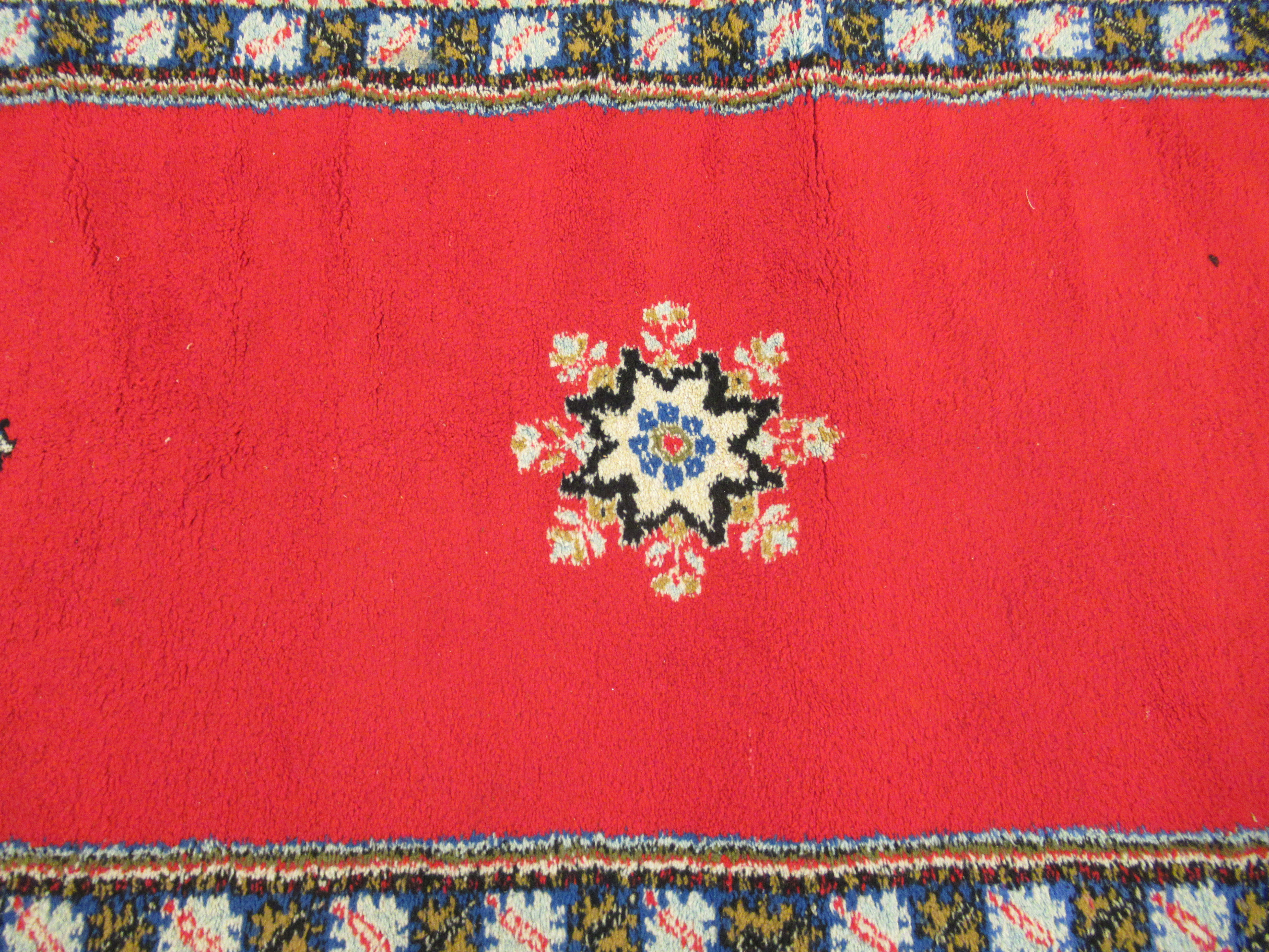 A Persian runner with opposing tasselled ends and three central starburst motifs, - Image 3 of 4
