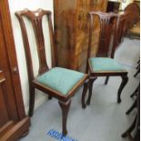 A pair of late 19th/early 20thC pierced splat back dining chairs,