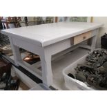 A modern white painted oak coffee table, the top raised on square, block legs 18.5''h 47.