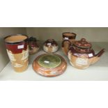 Six items of Doulton Lambeth and Royal Doulton two tone brown glazed stoneware: to include a beaker;