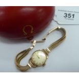 A lady's Omega 9ct gold round cased bracelet wristwatch,