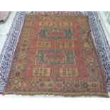 A Middle Eastern rug, decorated with geometric designs,