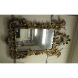 A Regency inspired mirror, set in a feathered floral, foliate,