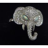 A silver elephant's head ring,