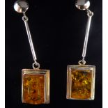 A pair of amber set silver framed drop earrings stamped 925 11