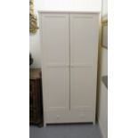 A modern John Lewis cream painted twin door wardrobe, over one long drawer,
