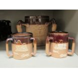 Three similar Doulton Lambeth two tone brown glazed stoneware jugs,