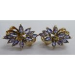 A pair of 9ct gold tanzanite set floral earrings 11
