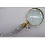 A brass framed magnifying glass,