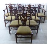 A set of ten Chippendale inspired mahogany framed dining chairs, the backs with yoke crests,