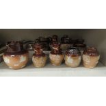 Doulton Lambeth and Royal Doulton two tone brown glazed stoneware condiments pots/miniature jugs,