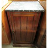 A late Victorian mahogany pot cupboard with a mottled black and white marble top,