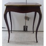 A late 19th/early 20thC Louis XV style mahogany serpentine outlined work table with inlaid brass