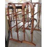 A pair of Victorian style beech framed freestanding towel rails with turned rods 29''h 32''w