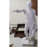 A composition (medically inspired) male nude with a detachable right arm,