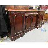 A mid Victorian mahogany chiffonier, the breakfront top, over three cupboard sections,