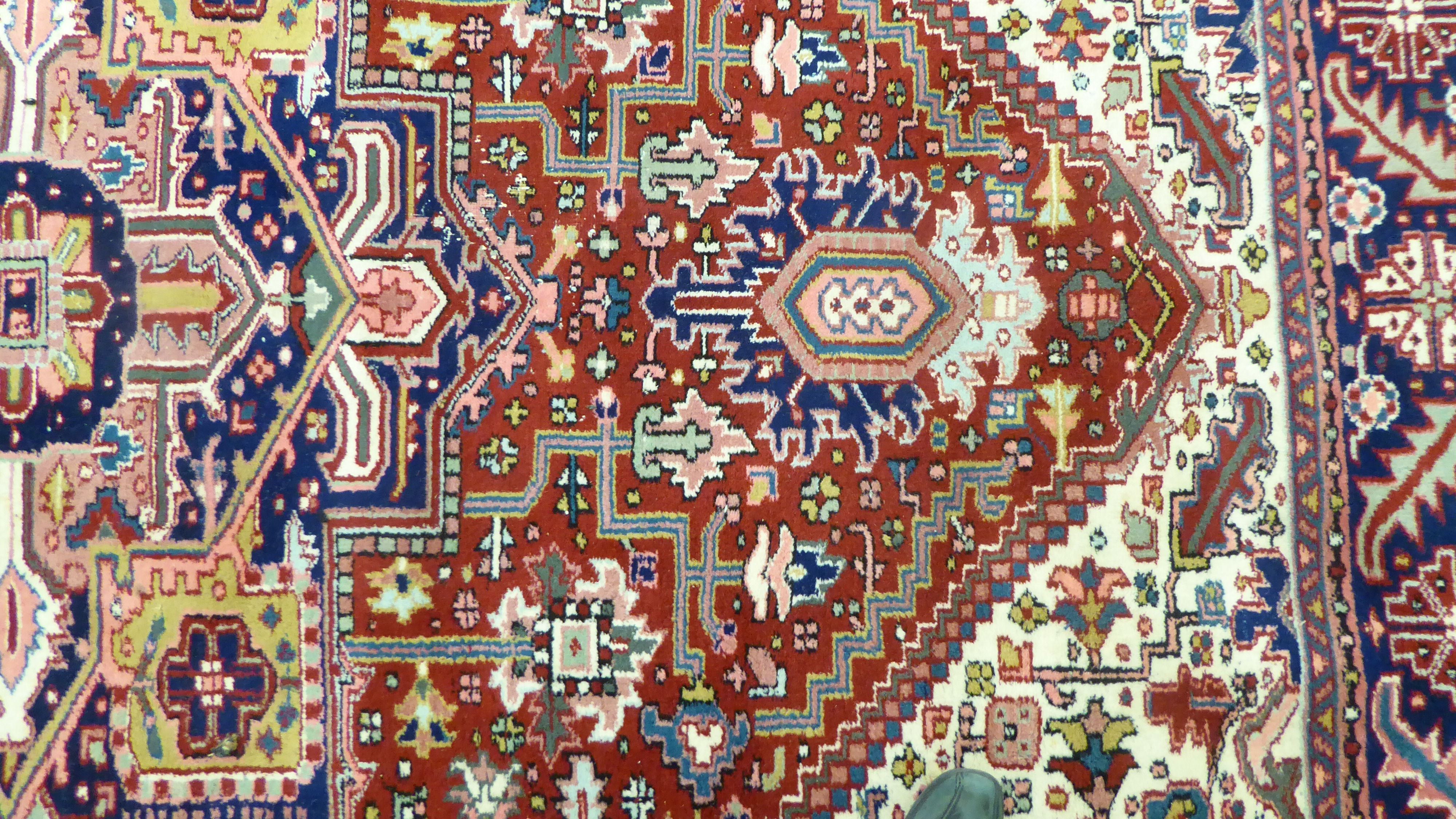 A Persian carpet, decorated with repeating geometric designs, - Image 4 of 5