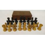 A Staunton pattern, naturally coloured and black stained, turned and carved boxwood chess set,