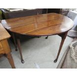 An early/mid 19thC mahogany gateleg dining table, the oval top raised on turned,