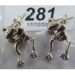 A pair of silver frog earrings stamped 925 11