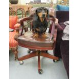 A 20thC mahogany showwood framed captain's style desk chair,