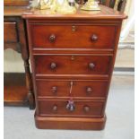 A modern Victorian style mahogany filing cabinet with a tooled and gilded brown hide scriber top,
