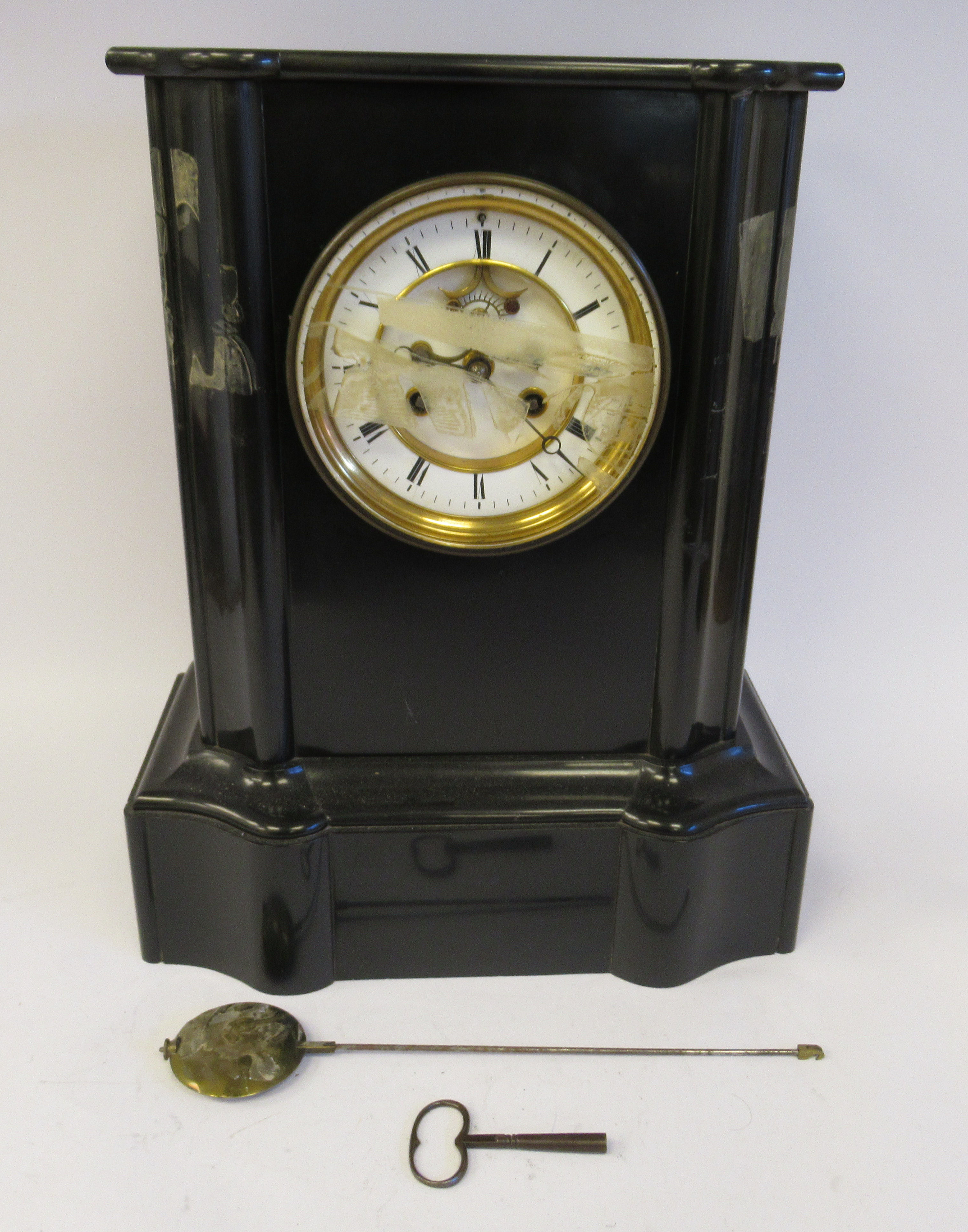 A late Victorian black slate cased breakfront mantel clock with a flat top and straight sides,