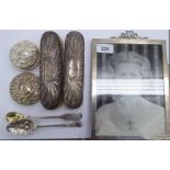 Silver collectables: to include a pair of clothes brushes; and a glazed photograph frame,