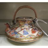 A mid 20thC Japanese Satsuma earthenware miniature teapot,