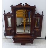 A late Victorian mahogany framed mirror, incorporating three bevelled plates,