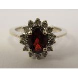 A 14ct gold claw set garnet and diamond,