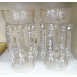 Two early 20thC clear glass lustre vases of trumpet form with prism cut pendants 11''h S