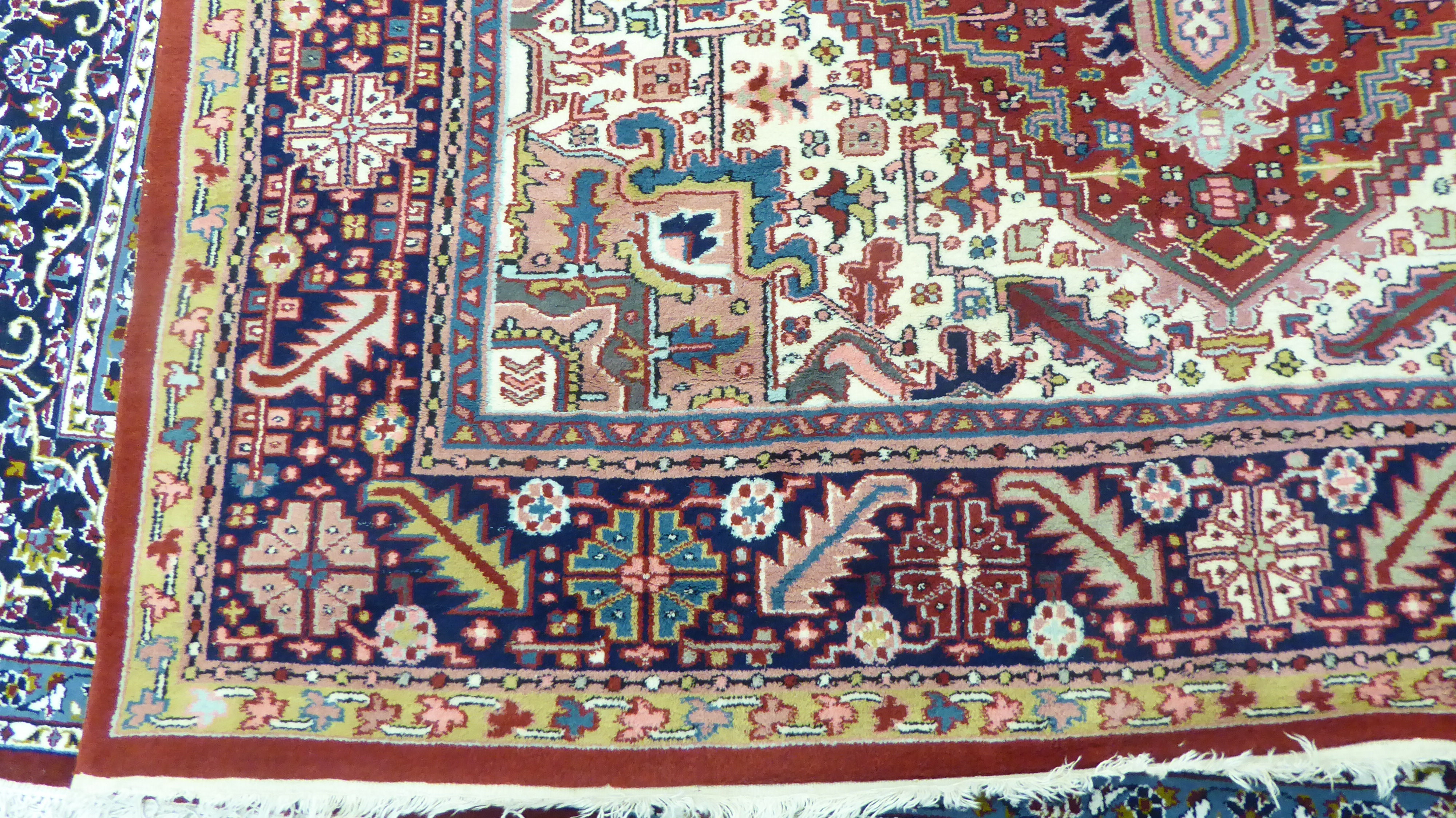 A Persian carpet, decorated with repeating geometric designs, - Image 2 of 5