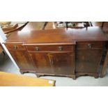 A modern crossbanded mahogany finished breakfront sideboard with three frieze drawers,