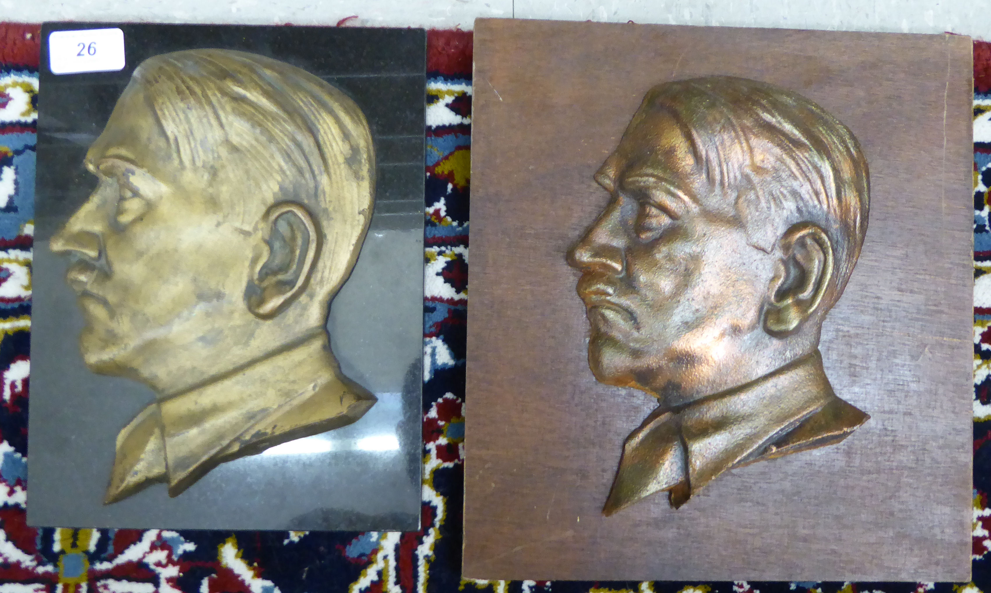 A gilded iron profile portrait plaque,