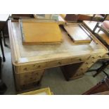 A late Victorian light oak pedestal desk, the top set with a rexine scriber,