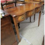 A modern crossbanded mahogany serving table with three frieze drawers, raised on square,