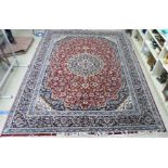 An Iranian carpet profusely decorated with floral and foliate designs,