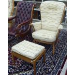 An Ercol beech framed high hoop and spindled back, enclosed arm chair,