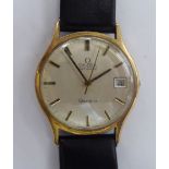 An Omega yellow metal cased automatic Geneve wristwatch, faced by a baton dial,