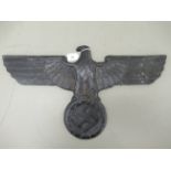 A black painted cast iron Third Reich insignia,