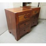 A pair of modern Indonesian teak three drawer bedside chests, raised on block feet 28''h 19.