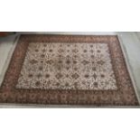 A Persian rug, decorated with floral designs,