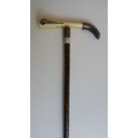 S.N. Cigar Cutter Walking Cane. London,1916.A very nice cane with cigar cutter fitted in handle.