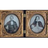 [ ANONYMOUS] Portraits of middle age coupleThe black lackey backing of the ambrotypes is flacking