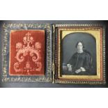 [ANONYMOUS] Portraits of two women and two young menThree daguerreotypes are in various disrepair