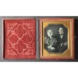 [ANONYMOUS] Portraits of middle age couplesThe man daguerreotype is holding a book and the woman