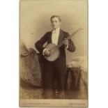 H. J. WHITLOCK / WHEELER [PHOTOGRAPHERS] [Two images:] A man playing a banjo; a woman playing